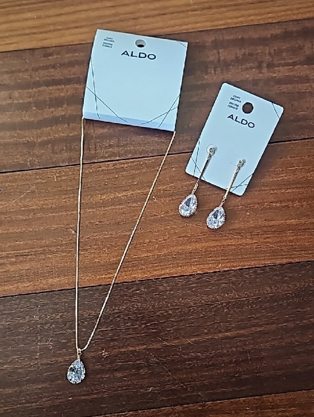 Aldo Gold Tone Necklace and Clear Teardrop Crystal Earrings Set